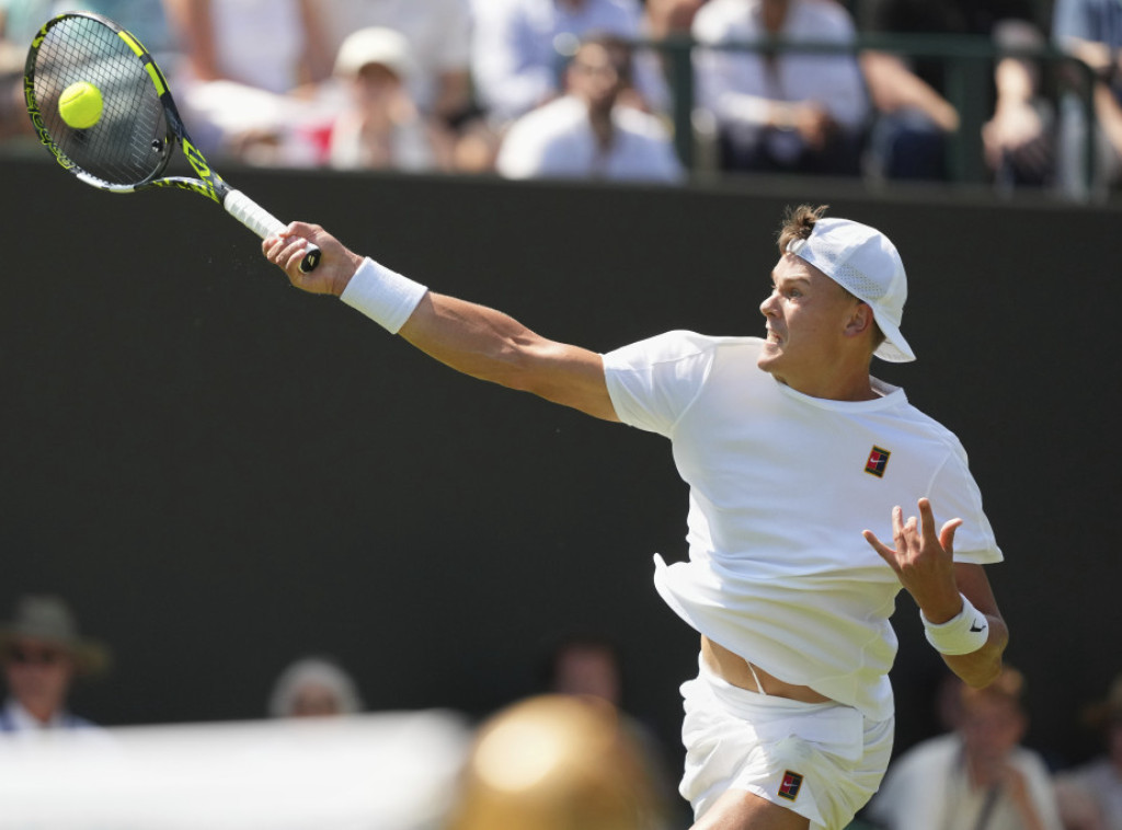 Holger Rune i Aleksej Popirin završili učešće na Vimbldonu u prvom kolu