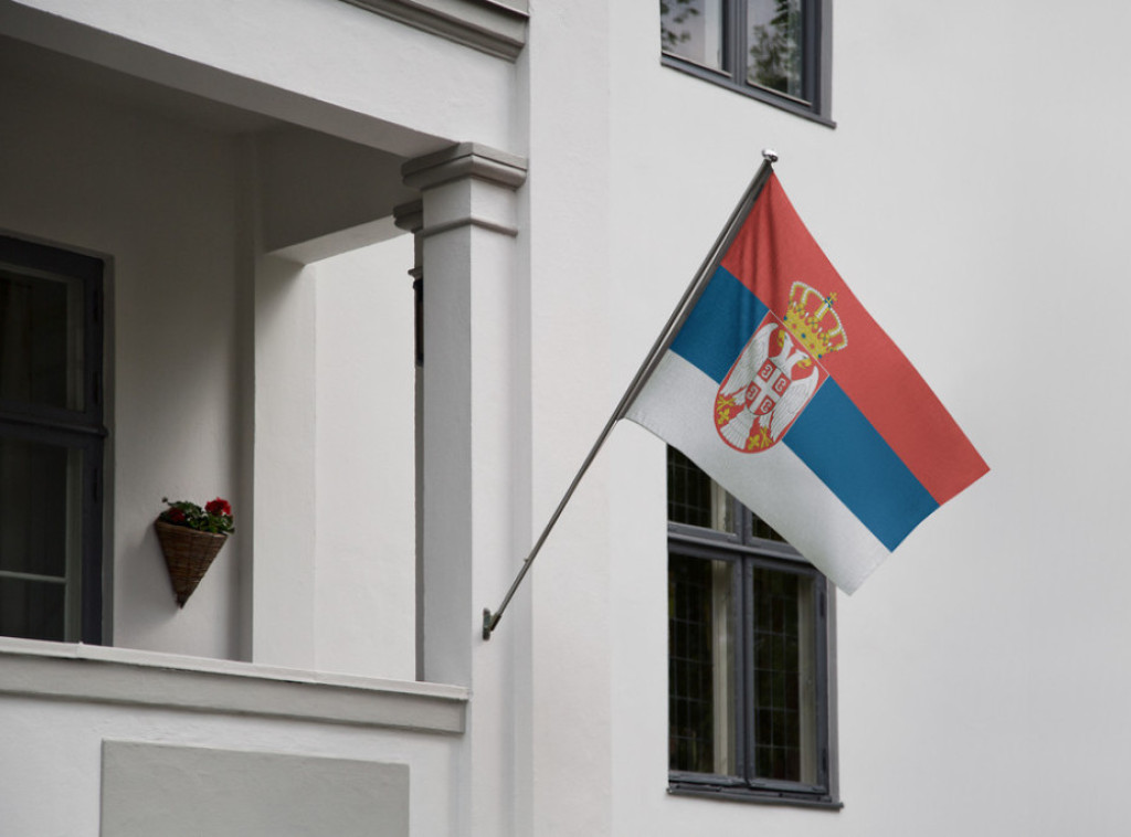 Unknown perpetrators place "KLA" flag outside Serbian embassy in Hague