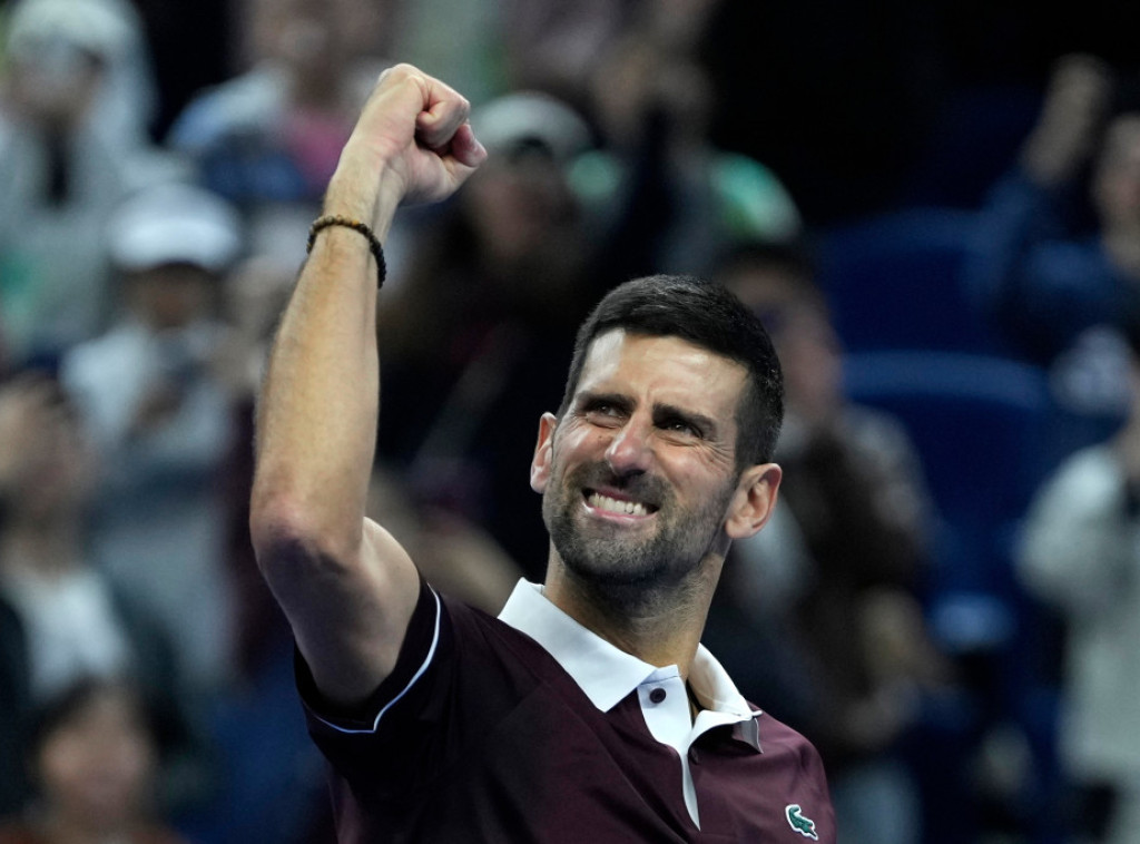 Djokovic beats Bu to advance to Beijing quarters